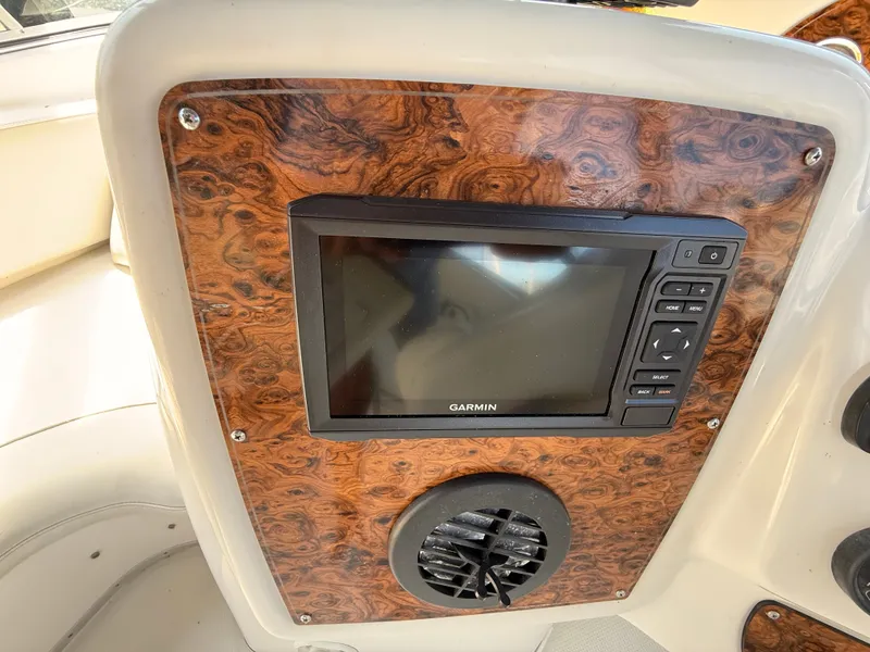 Slide: The Image of 2002 Bayliner 3488 Motoryacht dashboard with Garmin navigation system and wood paneling. - 20