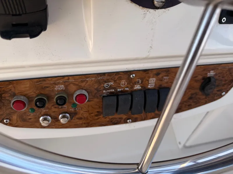 Slide: The Image of Control panel of a 2002 Bayliner 3488 Motoryacht with switches and buttons. - 24