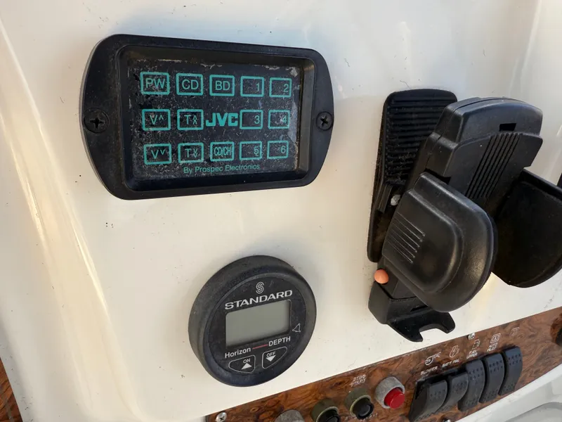 Slide: The Image of Control panel of a 2002 Bayliner 3488 Motoryacht with JVC and Standard Horizon displays. - 26