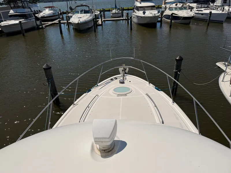 Slide: The Image of Bow view of 2002 Bayliner 3488 Motoryacht docked in a marina. - 27