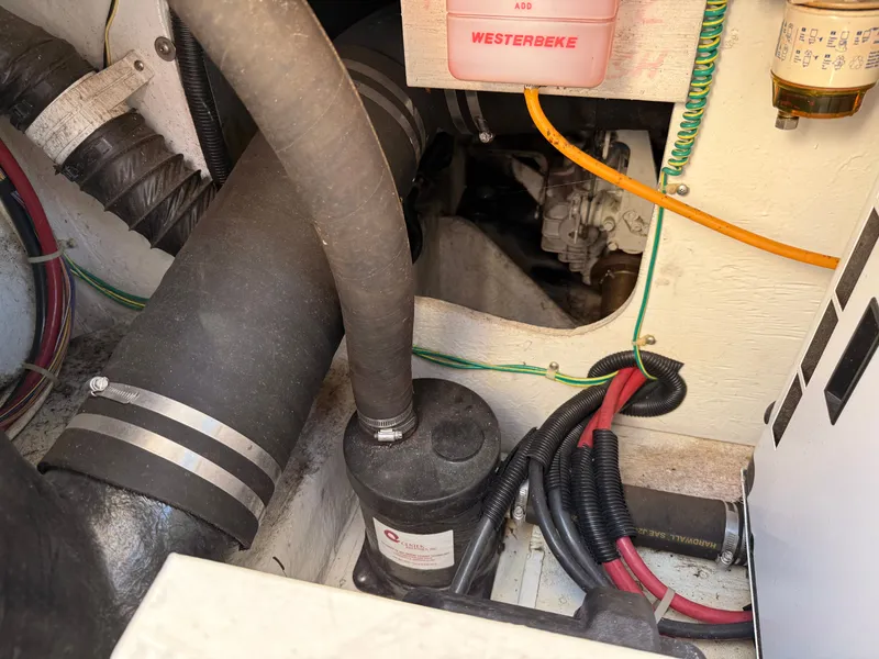 Slide: The Image of Engine compartment of a 2002 Bayliner 3488 Motoryacht with visible wiring and components. - 33