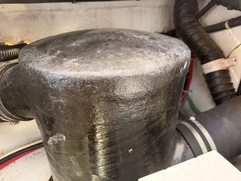 Slide: The Image of Engine compartment of a 2002 Bayliner 3488 Motoryacht, showing a large black component. - 35