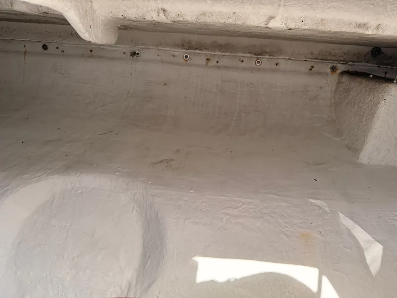 Slide: The Image of Interior view of a 2002 Bayliner 3488 Motoryacht, showing fiberglass surface details. - 36