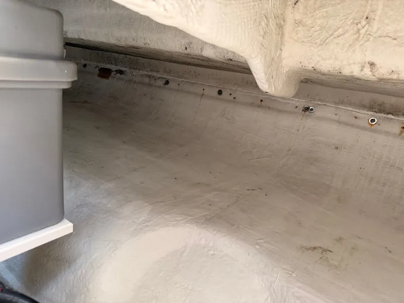 Slide: The Image of Interior view of 2002 Bayliner 3488 Motoryacht hull with visible bolts and fiberglass structure. - 38