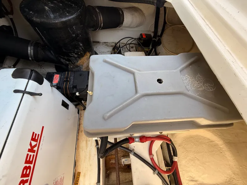 Slide: The Image of Engine compartment of a 2002 Bayliner 3488 Motoryacht, featuring mechanical components and wiring. - 41