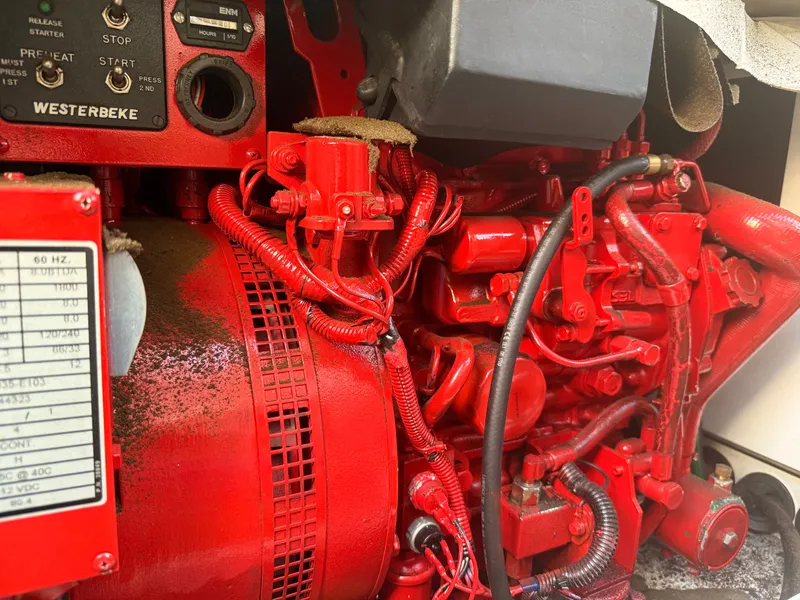 Slide: The Image of Red engine of a 2002 Bayliner 3488 Motoryacht, featuring detailed wiring and components. - 47