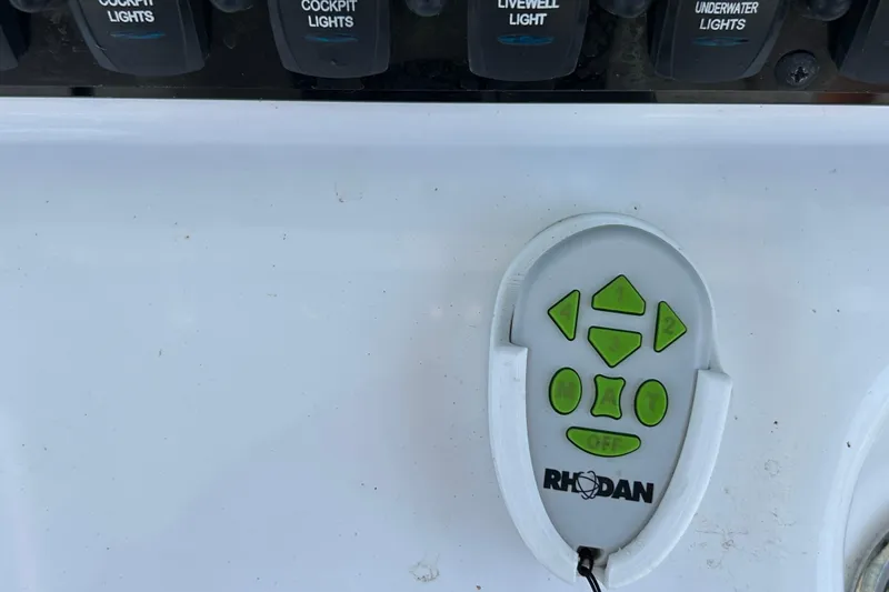 Slide: The Image of Control panel and Rhodan remote on 2021 Sea Hunt Gamefish 25 boat. - 22