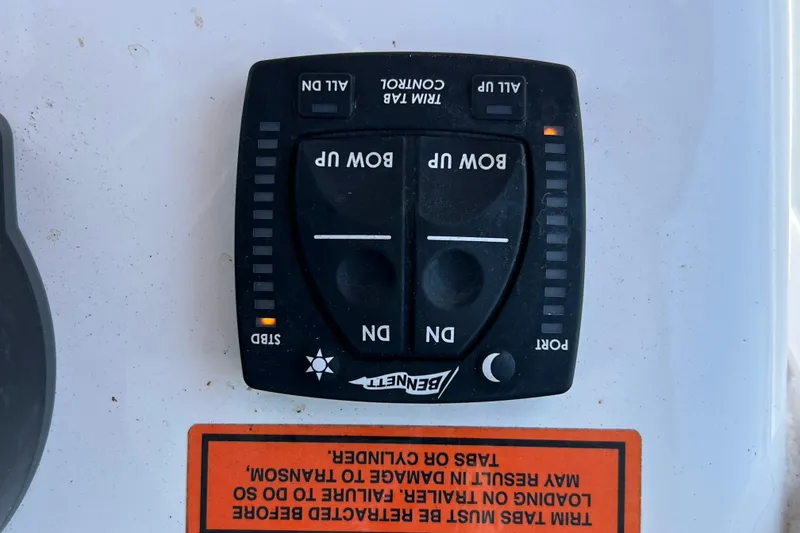 Slide: The Image of Bennett trim tab control panel on 2021 Sea Hunt Gamefish 25 boat. - 24