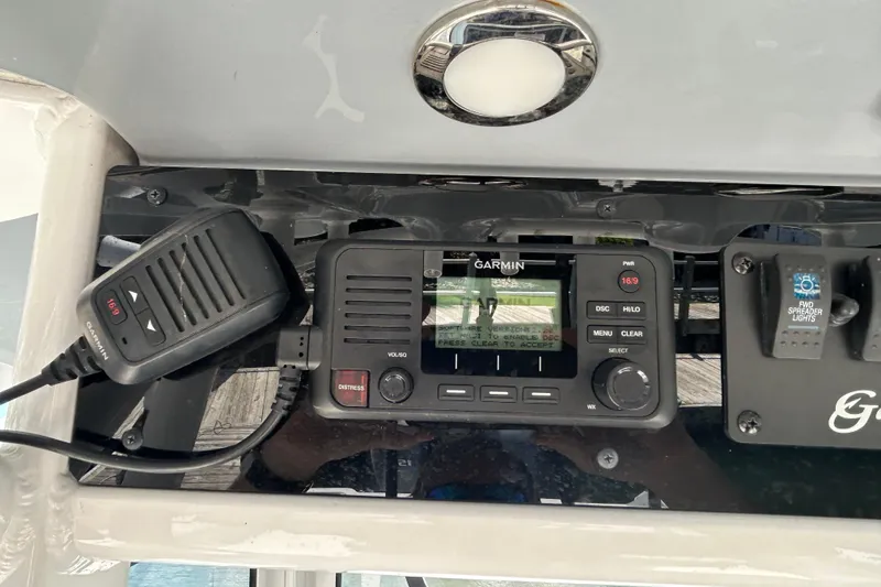 Slide: The Image of Garmin marine radio on 2021 Sea Hunt Gamefish 25 boat dashboard. - 30