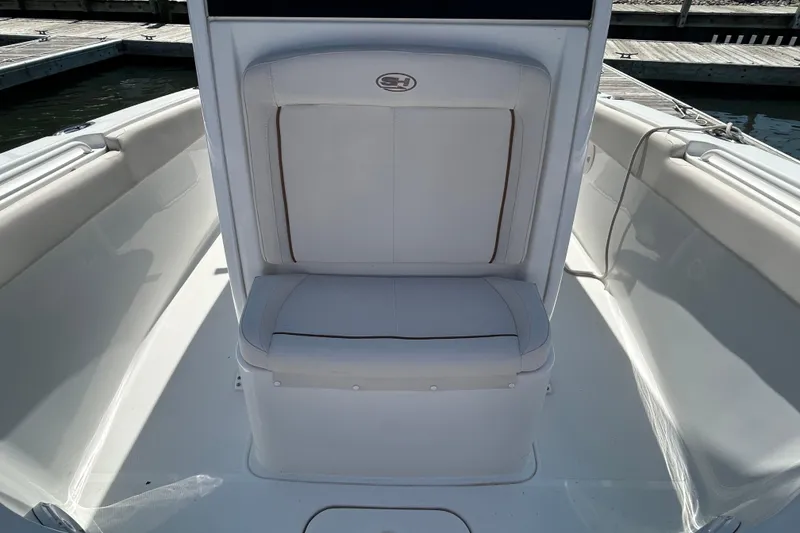 Slide: The Image of 2021 Sea Hunt Gamefish 25 boat interior with white seating and sleek design. - 36