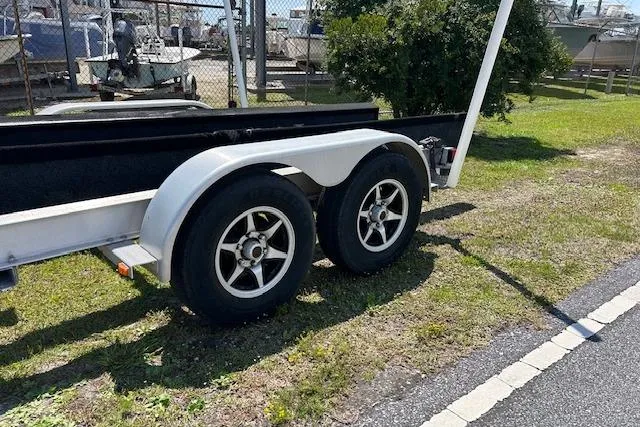 Slide: The Image of Trailer for 2021 Sea Hunt Gamefish 25, parked on grass beside a road. - 45