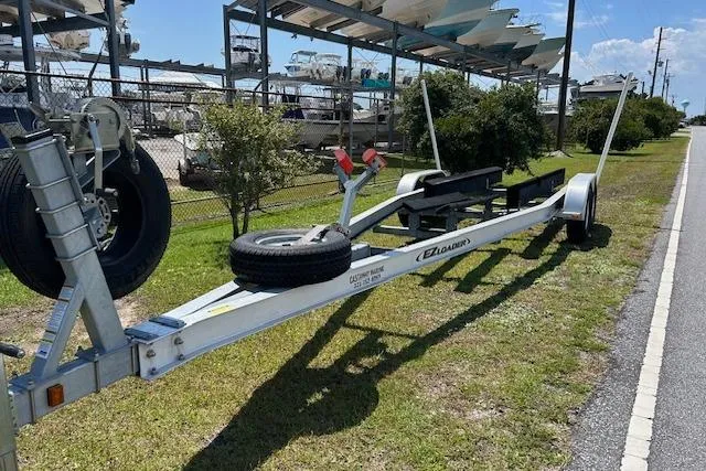 Slide: The Image of Trailer for 2021 Sea Hunt Gamefish 25 boat parked on roadside. - 46