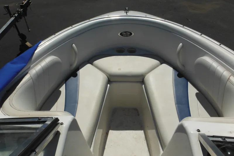 Slide: The Image of 2003 Chaparral 180 SS boat interior with white and blue seating. - 12