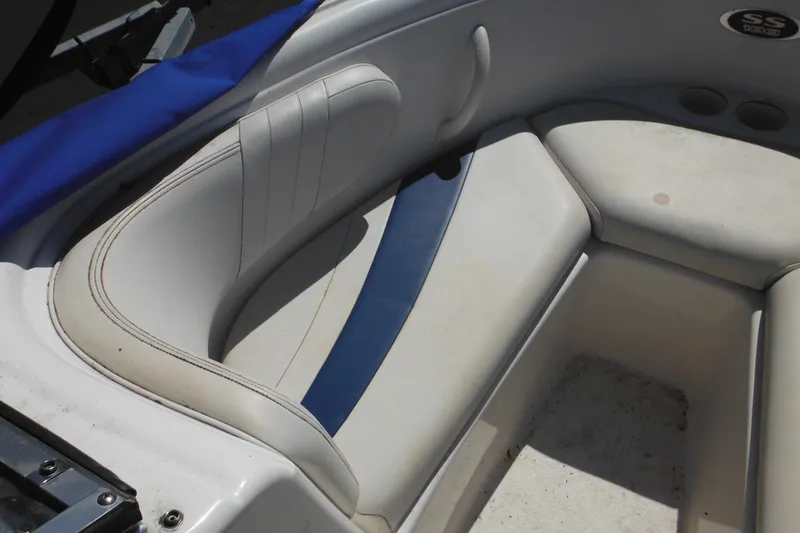 Slide: The Image of 2003 Chaparral 180 SS boat interior with white and blue seating. - 14
