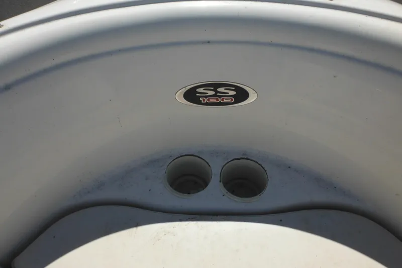 Slide: The Image of 2003 Chaparral 180 SS boat interior detail with logo and cup holders. - 15