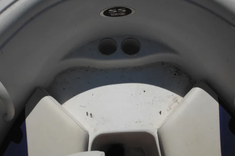 Slide: The Image of 2003 Chaparral 180 SS boat interior with cup holders and seating area. - 17