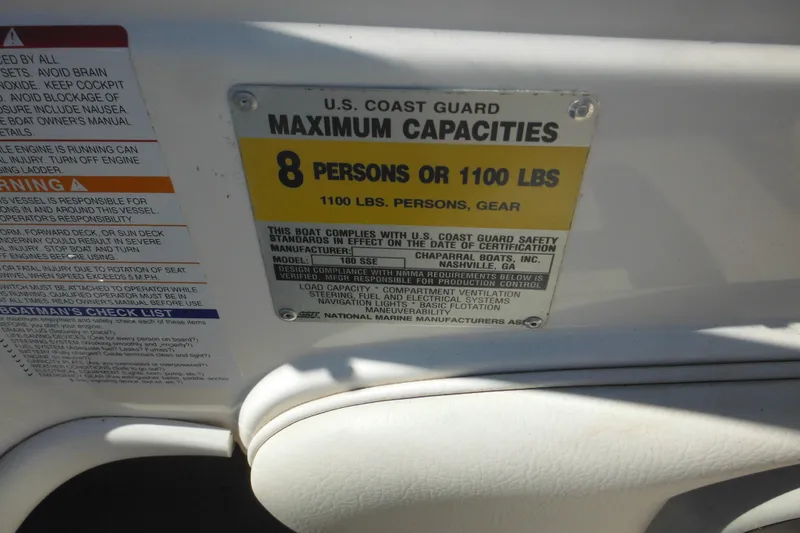 Slide: The Image of U.S. Coast Guard capacity label on 2003 Chaparral 180 SS, max 8 persons or 1100 lbs. - 25