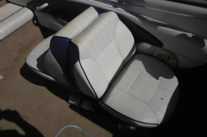 Slide: The Image of White and blue seating in 2003 Chaparral 180 SS boat interior. - 27