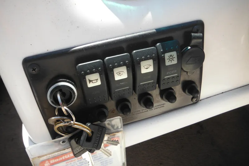Slide: The Image of Control panel of a 2003 Chaparral 180 SS boat with keys inserted. - 29