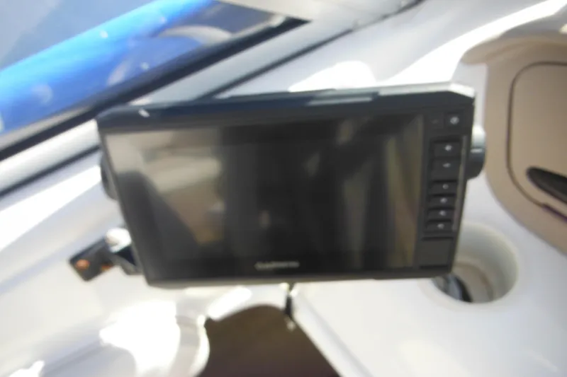 Slide: The Image of Dashboard of 2003 Chaparral 180 SS boat with mounted Garmin device. - 31