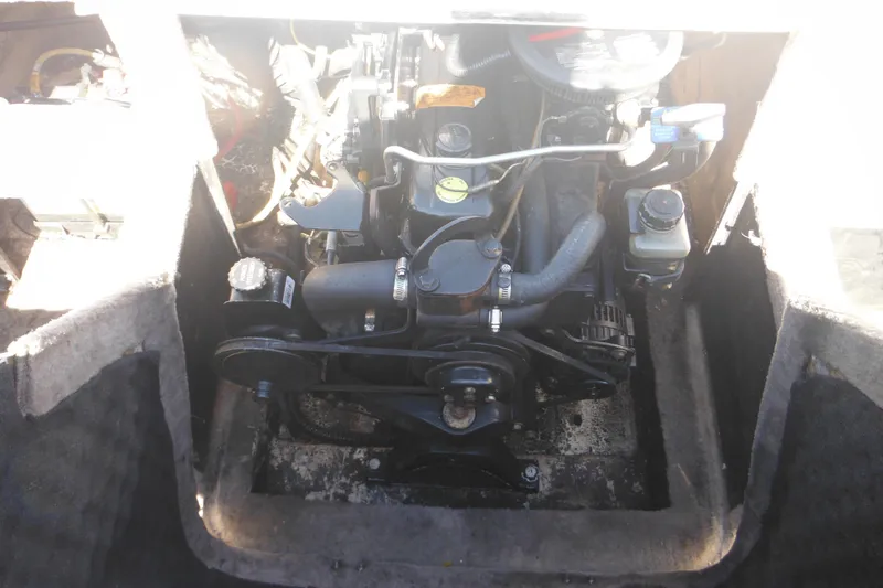 Slide: The Image of Engine compartment of a 2003 Chaparral 180 SS boat, showing detailed mechanical components. - 36