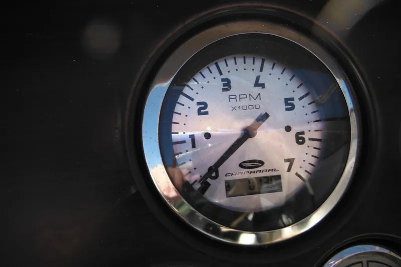 Slide: The Image of Close-up of a 2003 Chaparral 180 SS RPM gauge displaying engine revolutions. - 38