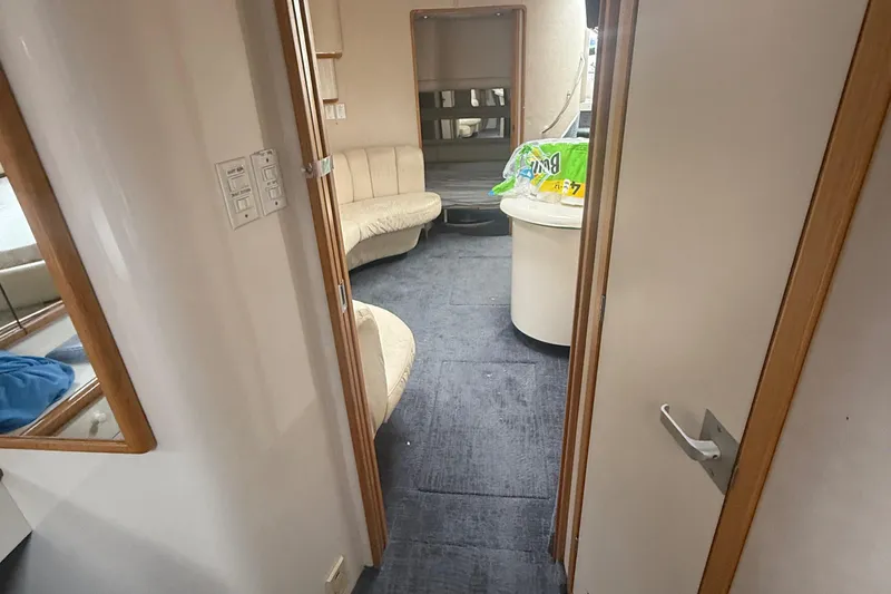 Slide: The Image of Interior of 1996 Sea Ray 450 Sundancer yacht, featuring seating and modern amenities. - 13