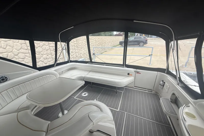 Slide: The Image of Interior of 1996 Sea Ray 450 Sundancer yacht with seating and table. - 4