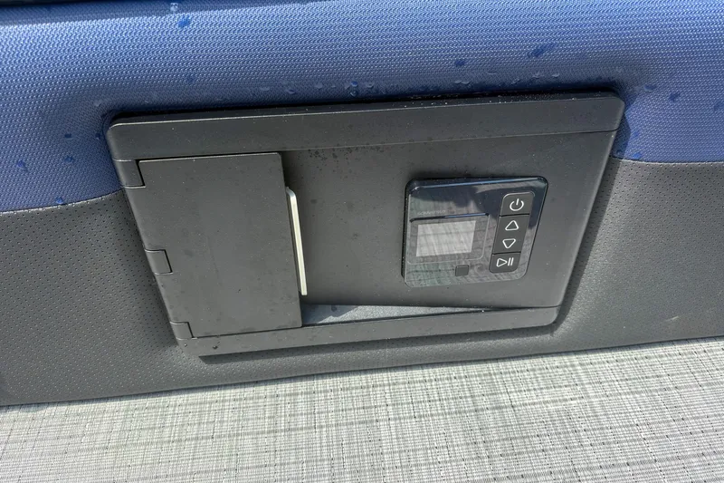 Slide: The Image of Control panel on 2025 Trifecta 24 UL CS boat, featuring buttons and display. - 6