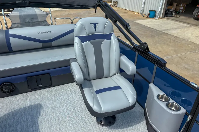 Slide: The Image of 2025 Trifecta 24 UL CS boat interior with luxurious seating and cup holders. - 7