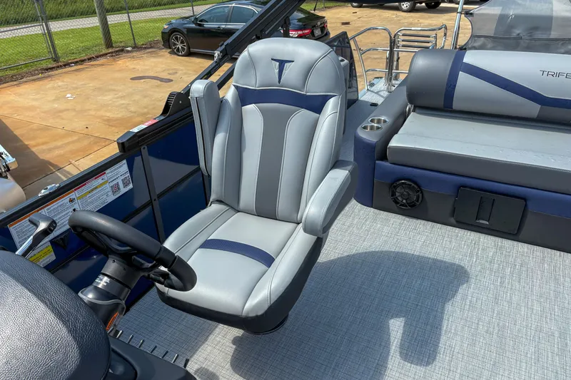 Slide: The Image of 2025 Trifecta 24 UL CS boat interior with gray and blue seating. - 8