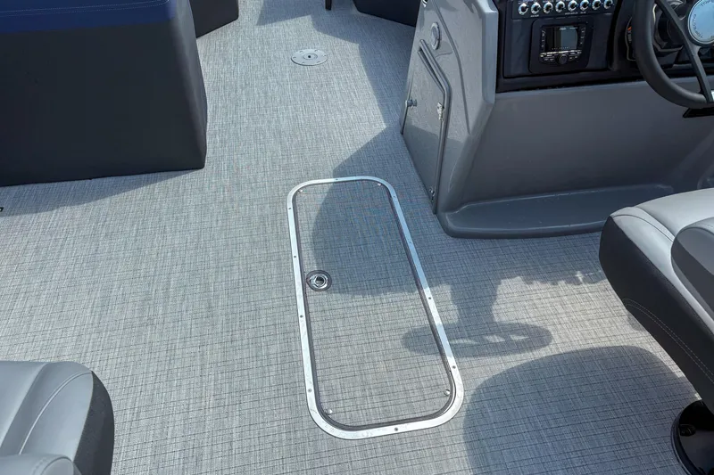 Slide: The Image of 2025 Trifecta 24 UL CS boat interior with sleek gray flooring and control panel. - 9