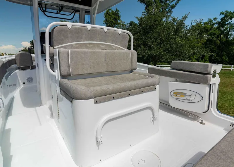 Slide: The Image of 2025 Sea Hunt Ultra 305 SE boat interior with cushioned seating and sleek design. - 22