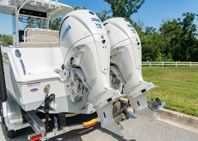 Slide: The Image of 2025 Sea Hunt Ultra 305 SE with twin Yamaha 300 V6 outboard engines. - 4