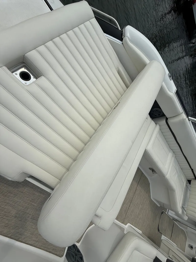 Slide: The Image of Luxurious seating on 2016 Cobalt A28 boat, featuring elegant white upholstery. - 12