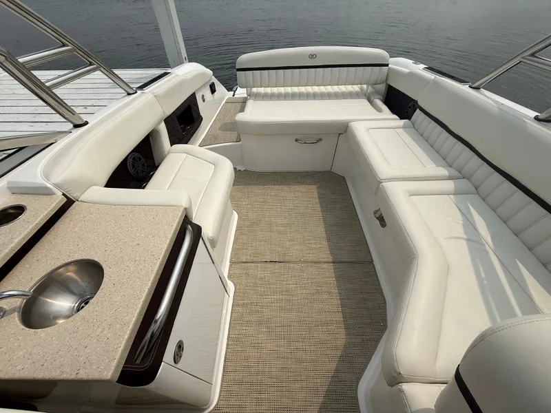 Slide: The Image of Luxurious 2016 Cobalt A28 boat interior with white seating and built-in sink. - 15