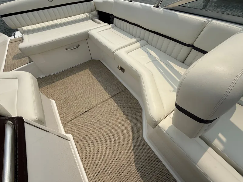 Slide: The Image of Luxurious seating area on a 2016 Cobalt A28 boat with white upholstery. - 17