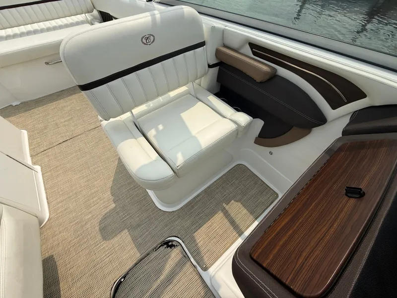 Slide: The Image of Luxurious interior of 2016 Cobalt A28 boat with white seating and wood accents. - 18