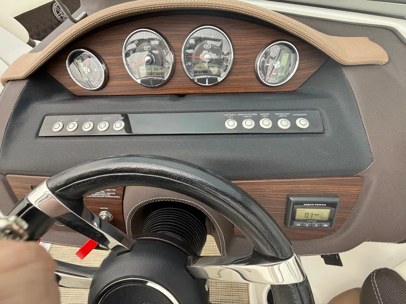 Slide: The Image of Dashboard of a 2016 Cobalt A28 boat with gauges and controls. - 21
