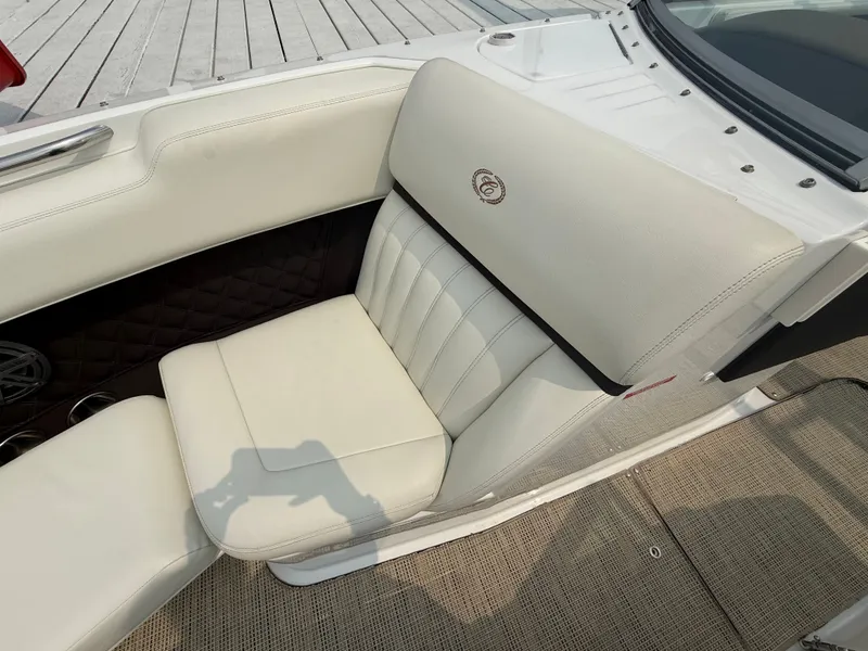 Slide: The Image of 2016 Cobalt A28 boat interior with white leather seating and elegant design. - 24