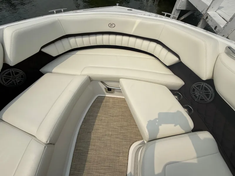 Slide: The Image of Luxurious seating area on a 2016 Cobalt A28 boat with white upholstery. - 25