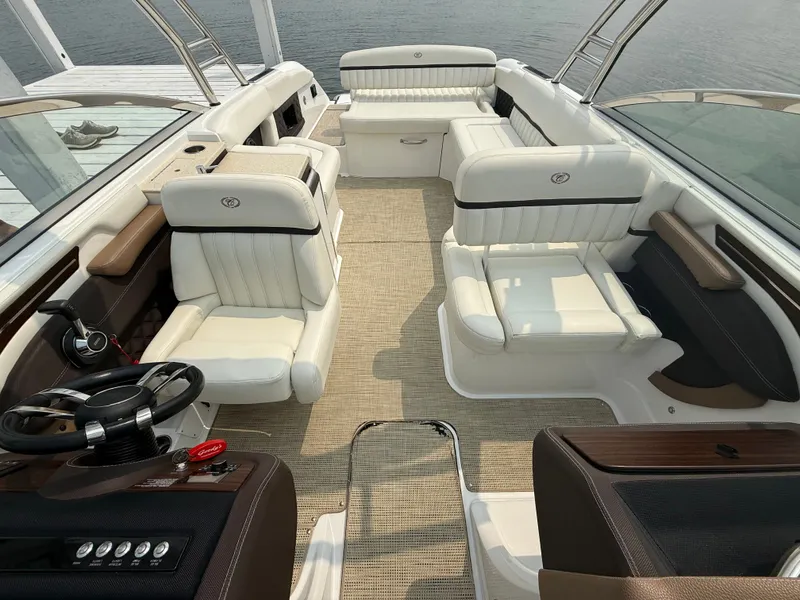 Slide: The Image of Luxurious interior of a 2016 Cobalt A28 boat with white leather seating and sleek design. - 28