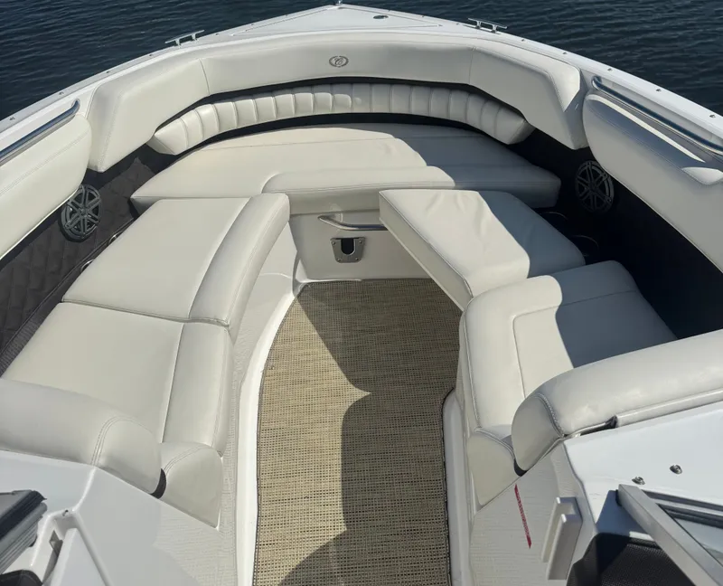 Slide: The Image of Luxurious seating area on a 2016 Cobalt A28 boat, featuring white leather upholstery. - 4