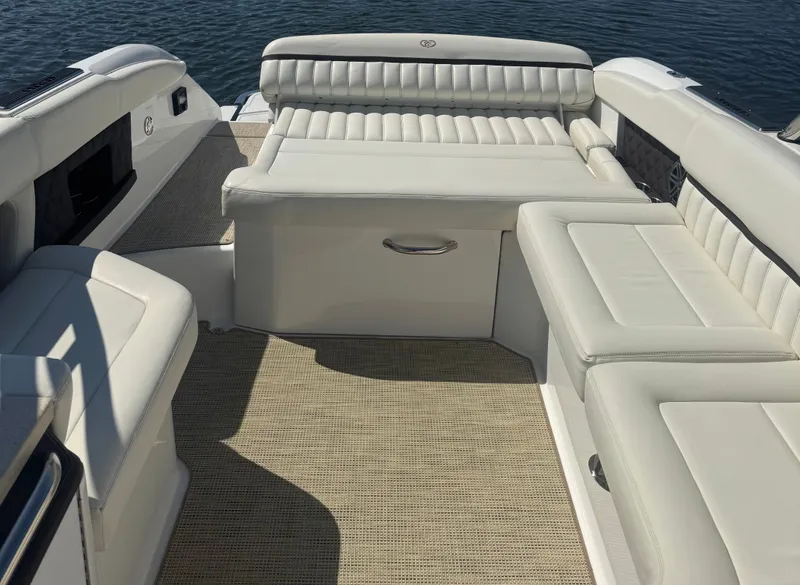 Slide: The Image of Luxurious seating area on a 2016 Cobalt A28 boat with white upholstery. - 5