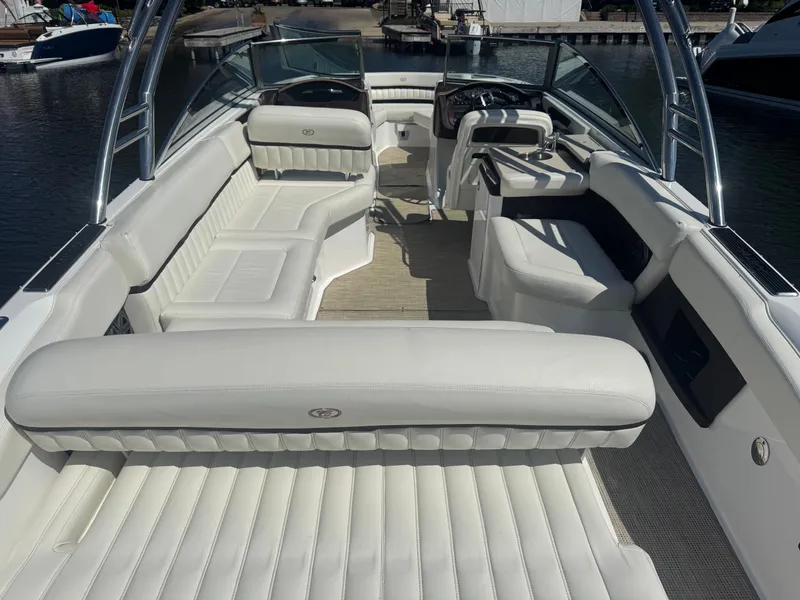 Slide: The Image of 2016 Cobalt A28 boat interior with white leather seating and sleek design. - 7