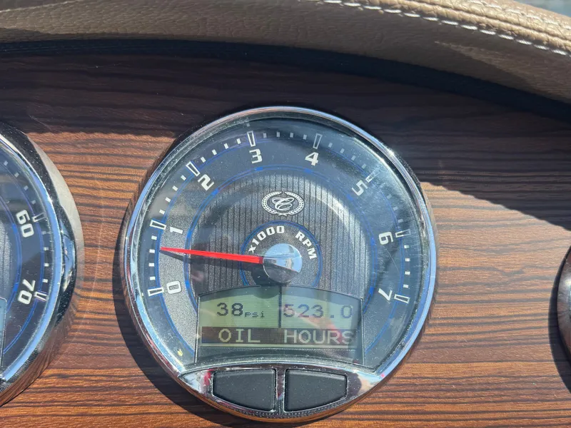 Slide: The Image of Tachometer of 2016 Cobalt A28 showing 38 psi and 523.0 oil hours. - 8
