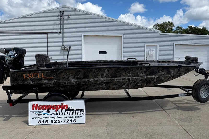 Slide: The Image of 2026 Excel Eclipse boat on trailer at Hennepin Marine dealership. - 0