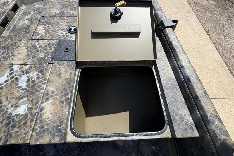 Slide: The Image of Open storage compartment on 2026 Excel Eclipse boat with camouflage pattern. - 10