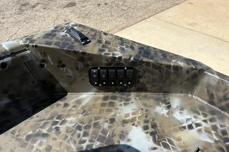 Slide: The Image of Control panel on 2026 Excel Eclipse boat with camouflage design. - 17