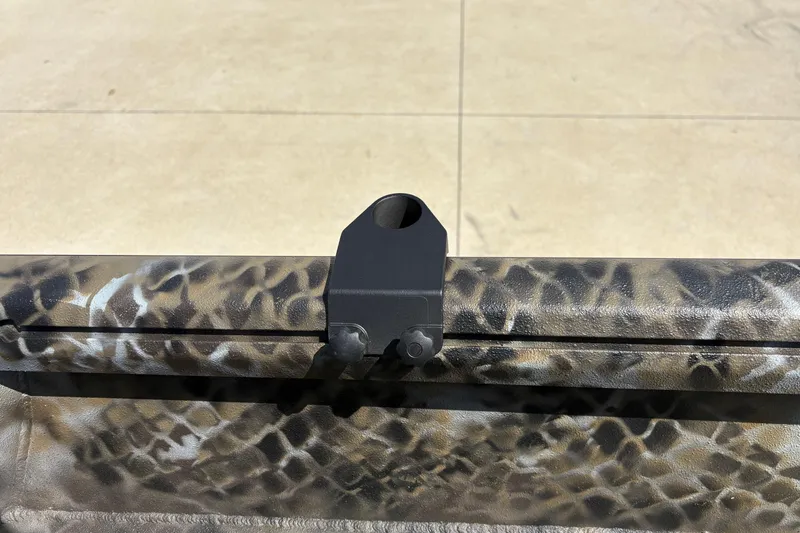 Slide: The Image of Camouflage-patterned Excel Eclipse 2026 boat detail with mounting bracket on a sunny day. - 18